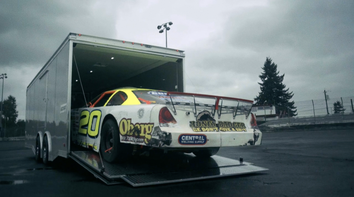 ACG Video Still racecar rolling out of trailer