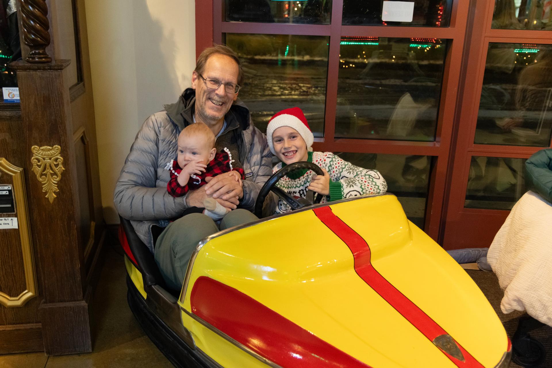 Family on a carousel car