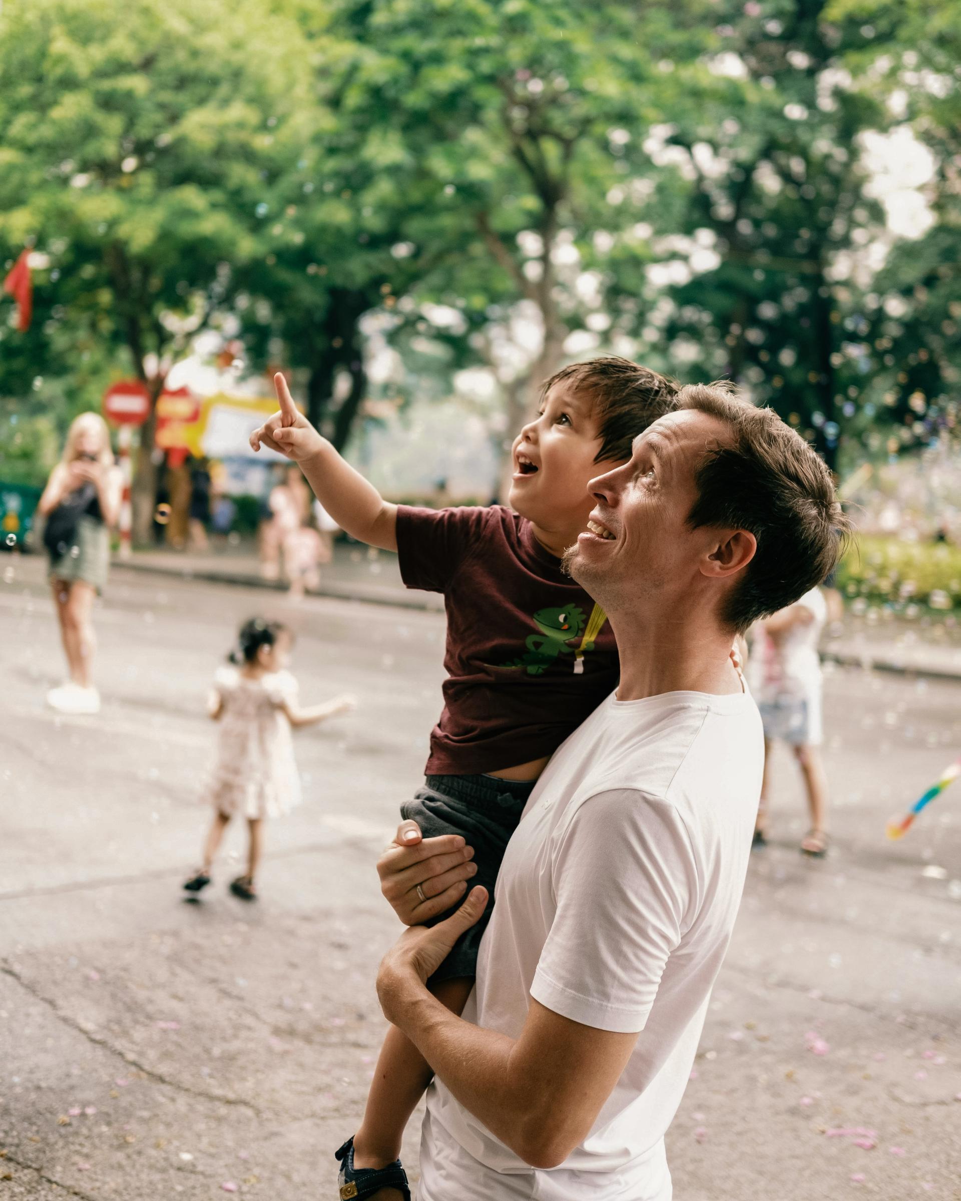 Excited kid pointing at bubbles