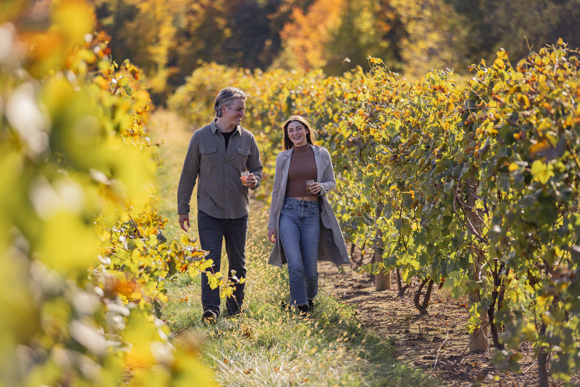 Makers Trail Photo, Couple walking through vineyard