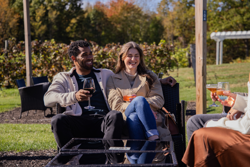 Makers Trail Couple Smiling Outside by Vineyard
