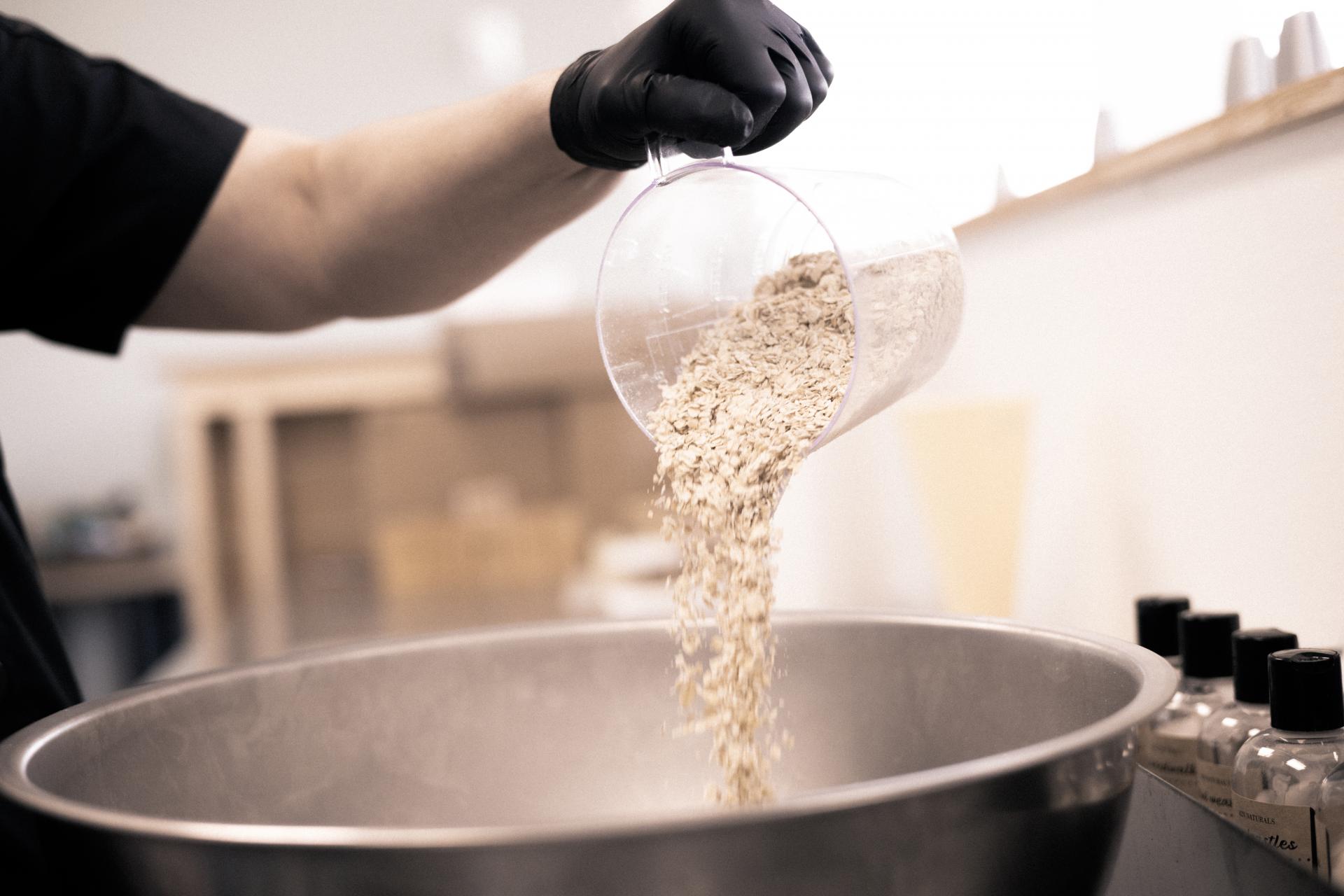 pouring oats into a bowl for 42N Naturals products